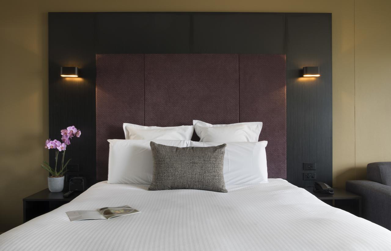 Hotel Pullman Sydney Hyde Park Exterior foto A bedroom at the hotel